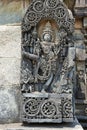 Ornate wall panel reliefs depicting Vishnu as Trivikrama. Ranganayaki, Andal, temple, Chennakesava temple complex, Belur, Karnatak Royalty Free Stock Photo