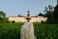 Ornate water fountain surrounded by lush greenery in Udaipur City, India