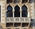 Ornate windows and balcony in Venice, Italy.