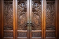 ornate wooden library door with intricate design
