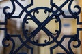 Ornate wrought-iron elements of metal gate decoration