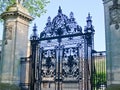 Ornate wrought iron gate Holyrood Palace, the residence of the Queen when in visiting Scotland