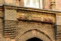 Ornate yellow brick exterior facade and window detail Royalty Free Stock Photo