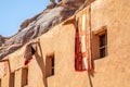 Ornated arabic carpets hanging from the roof of traditional mud houses, Al Ula, Medina province