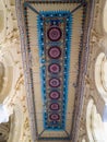 The ornately carved, colorful and decorated ceiling of the ancient Tirumalai Nayak Royalty Free Stock Photo