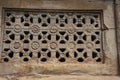 Ornately sculpted windows of temples in Aihole in Karnataka, India Royalty Free Stock Photo