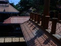 Ornately tiled rooftop with sculptural details of traditional East Asian affluent homeowner.