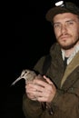 Ornithologist holding the eurasian Woodcock in hands