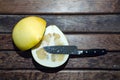 Oroblanco Citrus Sweetie, a pomelo lies cut in half on a wooden cutting board Royalty Free Stock Photo