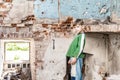 Orphaned children, poor child standing in a destroyed and abandoned building, staged photo