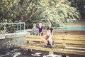 Orphaned children sit in an abandoned park on old benches