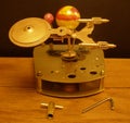 Orrery steampunk art clock with planets of the solar system.