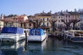Orta San Giulio Italy: boats moored in the lake harbour Royalty Free Stock Photo