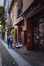 Embraced couple strolling in the village of Orta San Giulio