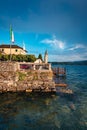 View of a building on Lake Orta with the Island of San Giulio in the background