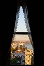 Ortakoy Buyuk Mecidiye Mosque and 15 Temmuz Sehitler Bogazici Bridge through a window with lace curtains