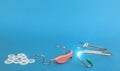 Orthodontic device: removable braces and cap,for upper and lower teeth,dental rubber bands on blue background.Copy space