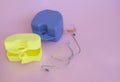 Orthodontic metal braces,plastic cap for upper and lower teeth,dental rubber bands,2 boxes on pink background.Copy space