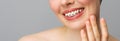 Orthodontic treatment. Closeup ceramic and metal brackets on teeth. Female smile with braces. Dental care concept.