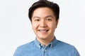 Orthodontics, dental care and stomatology concept. Close-up portrait of handsome asian man with teeth braces, smiling