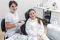 Orthodontist checking brackets on female teeth. Concept of stomatology, dentistry, orthodontic treatment of braces