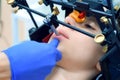 Orthodontist is doing condylography procedure examining mandibular joints. Royalty Free Stock Photo