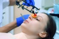 Orthodontist is fixing equipment on woman& x27;s patient teeth before condylography. Royalty Free Stock Photo