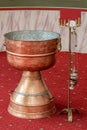 Orthodox baptism bowl of holy water and candles Royalty Free Stock Photo