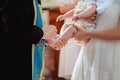 Orthodox baptism. priest puts crosses brush in oil