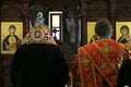 Orthodox bishop and archdeacon praying in front of altar Royalty Free Stock Photo