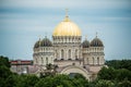 Orthodox Cathedral golden dome above Riga city trees. Royalty Free Stock Photo