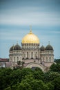 Orthodox Cathedral golden dome above Riga city trees.