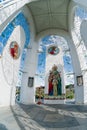 Orthodox chapel white with a transparent facade on the background of the panorama of the sea and blue sky in a field Royalty Free Stock Photo