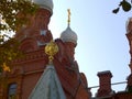 Orthodox Christian Church with white domes, golden crosses and coat of arms of Russia double-headed eagle. Located in Pushkin, sub Royalty Free Stock Photo