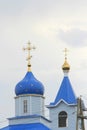 Orthodox Christian church with white walls, blue domes and golden crosses in Russia. A building for religious ceremonies Royalty Free Stock Photo