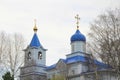 Orthodox Christian church with white walls, blue domes and golden crosses in Russia. A building for religious ceremonies Royalty Free Stock Photo