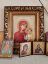 Orthodox Christian icons are on the shelf