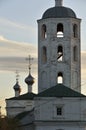 Orthodox Christian white stone Church in Russia on the banks of the Volga river on a summer day in the evening