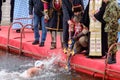 Orthodox Christians swimming for the Holy Cross in the icy cold water