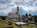 Orthodox Church of All Saints in the village of Bosanski LuÃÂ¾ani with a cemetery during a cloudy day. Tombstones of the deceased Royalty Free Stock Photo