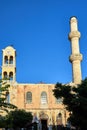 Orthodox church with a bell tower and a minaret in the town of Chania on the island of Crete Royalty Free Stock Photo