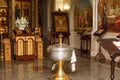 Orthodox Church candles with icons, the Bible and the cross