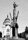 Statue of Avram Iancu and orthodox cathedral. Typical urban landscape in downtown Cluj-Napoca. Royalty Free Stock Photo