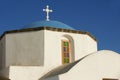 Orthodox church dome and cross in Pyrgos, Santorini, Greece. Royalty Free Stock Photo