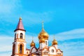 Orthodox Church Golden domes with cross on a background of blue sky. Temple of the New Martyrs and Confessors of Russia. Royalty Free Stock Photo