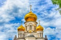 Orthodox Church, golden domes with crosses close-up against a blue cloudy sky, HDR photo Royalty Free Stock Photo