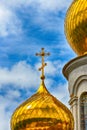 Orthodox Church, golden domes with crosses close-up against a blue cloudy sky, HDR photo Royalty Free Stock Photo