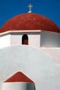 Orthodox church in Mykonos with red cupola Royalty Free Stock Photo