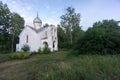 Orthodox Church and nature. Green garden and architecture. Under the blue sky a house which is surrounded by a beautiful nature