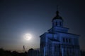 Orthodox church at night under the full moon and dark blue sky (June \